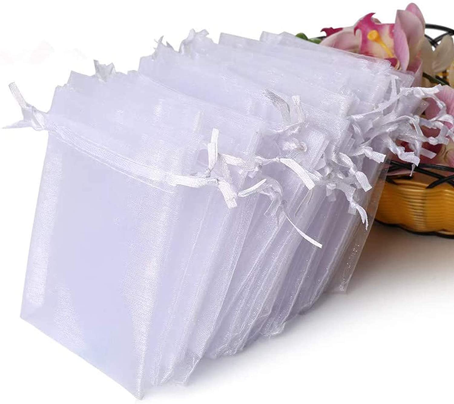 Hopttreely white sheer organza gift bags with drawstrings arranged together